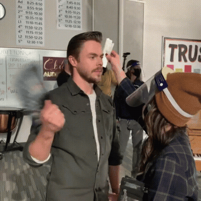 Man And Woman Standing Before Trus Sign GIF
