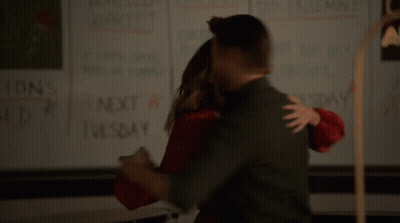 Man And Woman Standing Before Trust Sign GIF