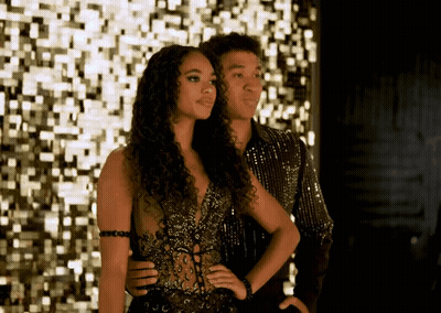Man And Woman Standing Beside Wall GIF