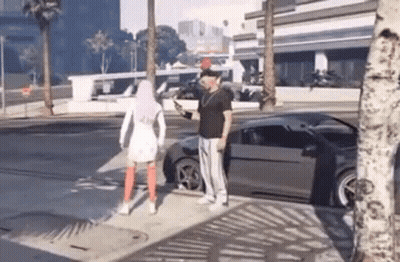 Man And Woman Standing By Car On Sidewalk GIF