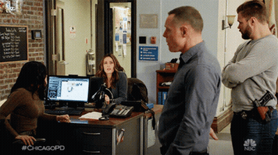Man And Woman Standing By Door GIF