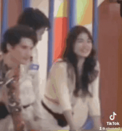 Man And Woman Standing By Window GIF