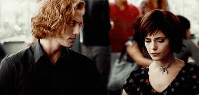 Man And Woman Standing In Crowded Area GIF