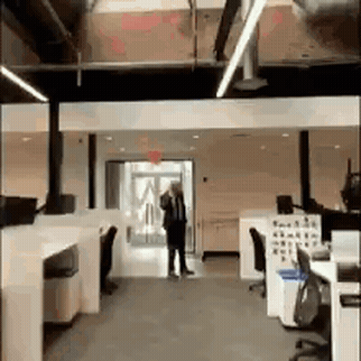 Man And Woman Standing In Cubicle GIF