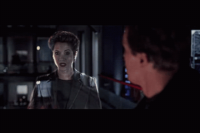 Man And Woman Standing In Dark Room GIF