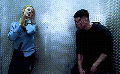 Man And Woman Standing In Dark Room GIF