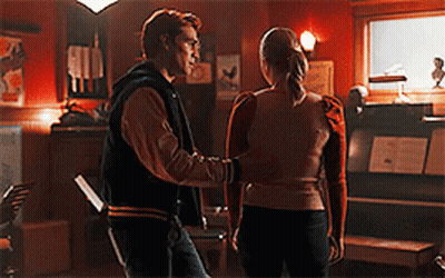 Man And Woman Standing In Dark Room GIF