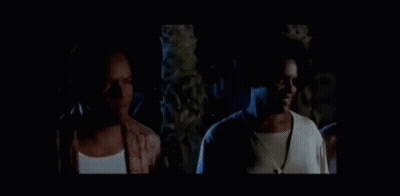 Man And Woman Standing In Dark Room GIF