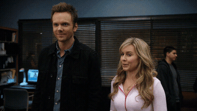 Man And Woman Standing In Dark Room GIF