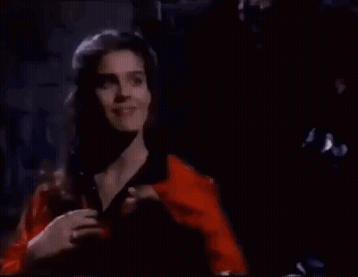Man And Woman Standing In Dark Room GIF