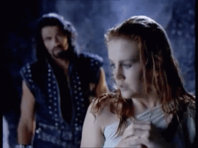 Man And Woman Standing In Dark Room GIF