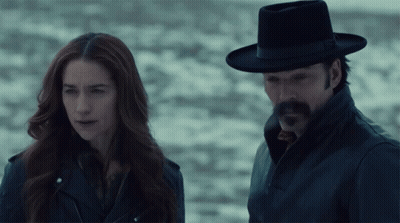 Man And Woman Standing In Dark GIF