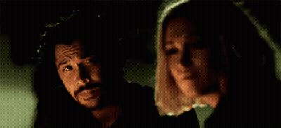 Man And Woman Standing In Darkness GIF