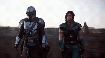 Man And Woman Standing In Desert GIF