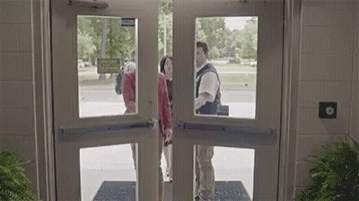 Man And Woman Standing In Doorway GIF