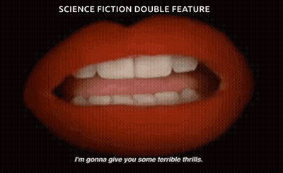 Man And Woman Standing In Front Of Candles GIF