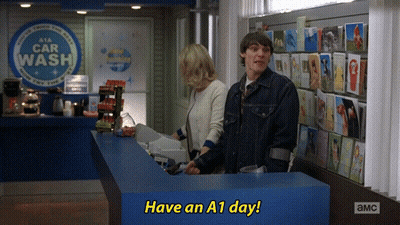 Man And Woman Standing In Front Of Car Wash GIF