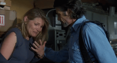 Man And Woman Standing In Front Of Cardboard Box With Arrows GIF