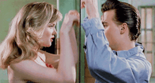 Man And Woman Standing In Front Of Door GIF