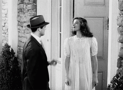 Man And Woman Standing In Front Of Door GIF