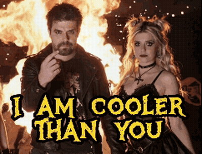 Man And Woman Standing In Front Of Fire I Am Cooler Than You GIF