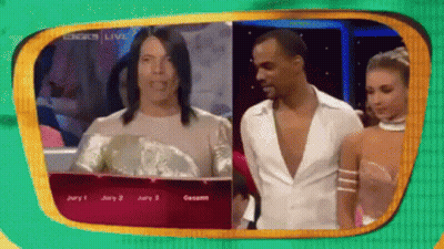 Man And Woman Standing In Front Of Jury 1 Screen GIF