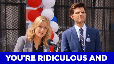 Man And Woman Standing In Front Of Microphone GIF
