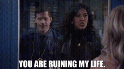 Man And Woman Standing In Front Of Mirror GIF