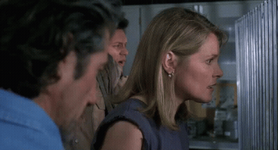 Man And Woman Standing In Front Of Refrigerator GIF