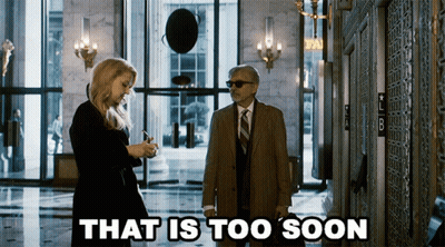 Man And Woman Standing In Hallway GIF