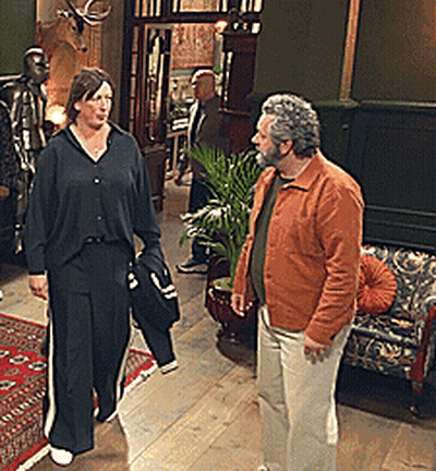 Man And Woman Standing In Hallway GIF