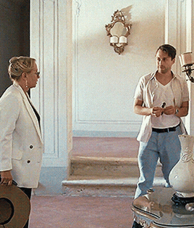 Man And Woman Standing In Hallway GIF