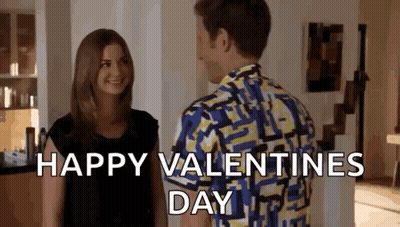 Man And Woman Standing In Living Room Man In Colorful Shirt GIF