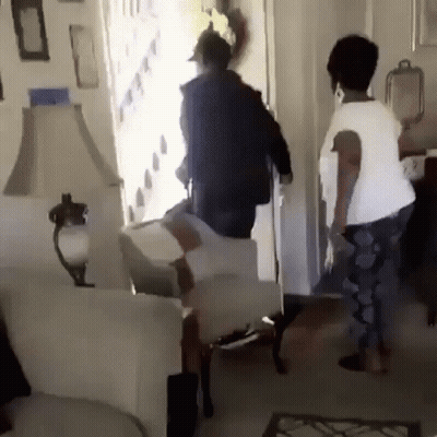 Man And Woman Standing In Living Room GIF