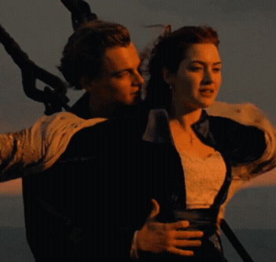 Man And Woman Standing In Ocean GIF