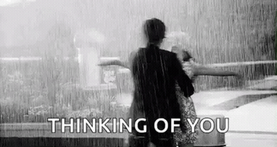 Man And Woman Standing In Rain GIF