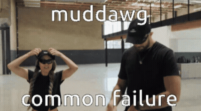 Man And Woman Standing In Room Muddawg GIF