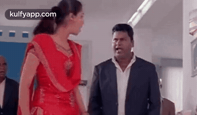 Man And Woman Standing In Room GIF