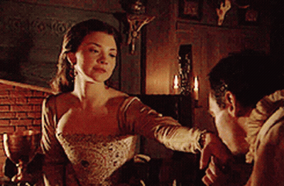 Man And Woman Standing In Room With Candles GIF