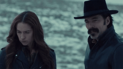 Man And Woman Standing In Snow GIF