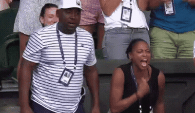 Man And Woman Standing In Stadium GIF