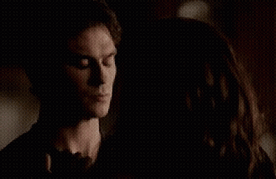 Man And Woman Standing In The Dark GIF