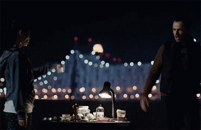 Man And Woman Standing In The Dark GIF