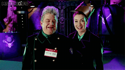 Man And Woman Standing, Man Says Hello GIF