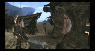 Man And Woman Standing Next To Anvil GIF