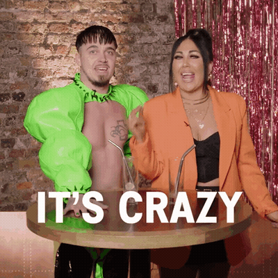 Man And Woman Standing Next To Crazy Table GIF