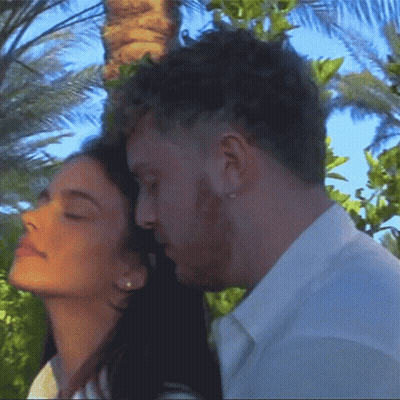 Man And Woman Standing Next To Each Other GIF