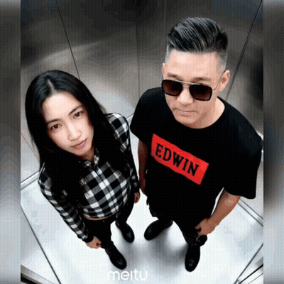Man and Woman Standing Next to Each Other in Edwin Shirt
