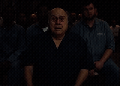 Man And Woman Standing Next To Each Other In Room GIF