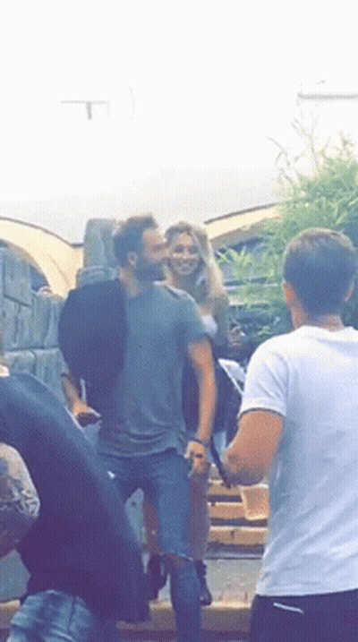 Man And Woman Standing Next To Each Other GIF